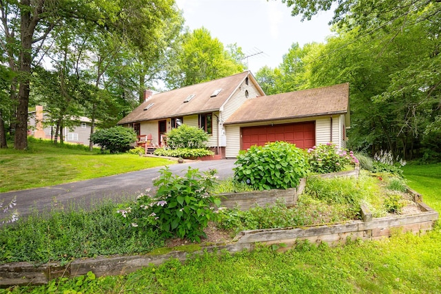 110 Read Rd, Red Hook, NY 12571 - view of front facade with a front yard, a garage, and a chimney