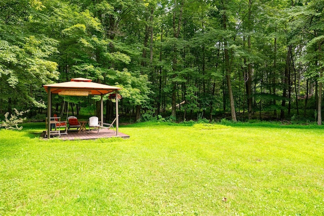 110 Read Rd, Red Hook, NY 12571 - view of green lawn with a gazebo, a wooded view, and a deck