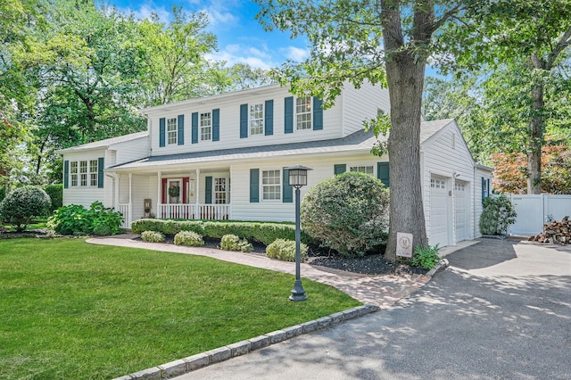 7 Simon Ct, East Northport, NY 11731 - view of front facade featuring a porch, driveway, and a garage