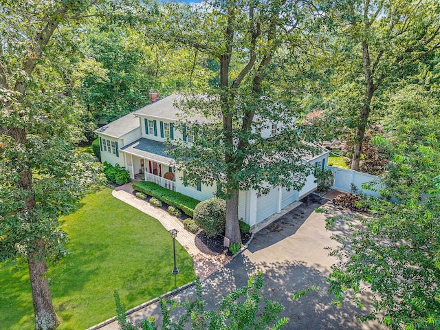 7 Simon Ct, East Northport, NY 11731 - view of front of property with driveway, a chimney, roof with shingles, and a porch