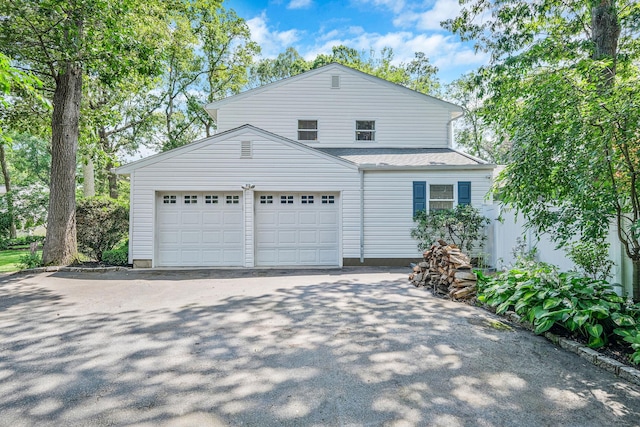7 Simon Ct, East Northport, NY 11731 - view of front of home featuring driveway and a garage