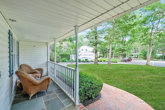 7 Simon Ct, East Northport, NY 11731 - covered porch featuring a lawn