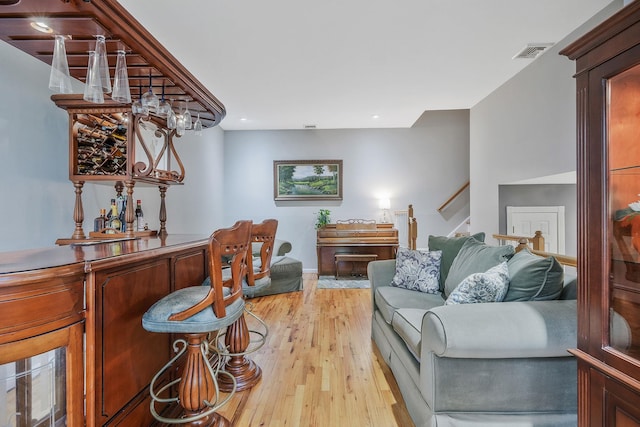 7 Simon Ct, East Northport, NY 11731 - living room with stairway, light wood-style floors, a bar, and recessed lighting