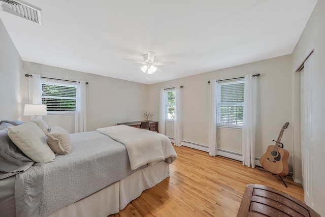 7 Simon Ct, East Northport, NY 11731 - bedroom featuring light wood-type flooring and a ceiling fan