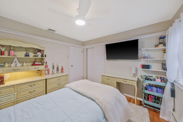 7 Simon Ct, East Northport, NY 11731 - bedroom with wood finished floors, a closet, and a ceiling fan