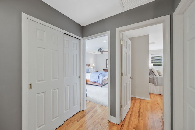 7 Simon Ct, East Northport, NY 11731 - corridor featuring light wood finished floors and baseboards