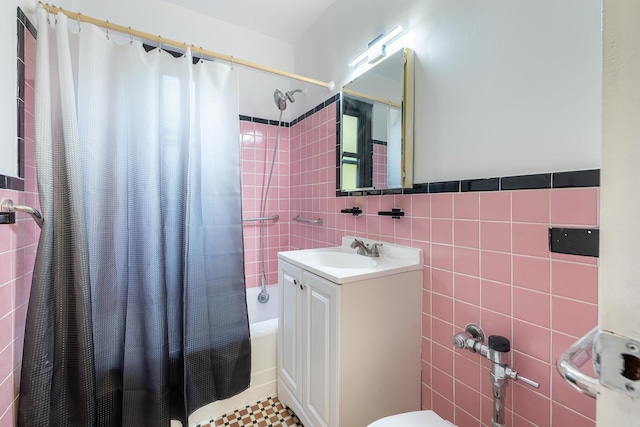 3850 Sedgwick Ave Unit 5B, Bronx, NY 10463 - bathroom featuring tile walls, shower / bath combo with shower curtain, and vanity