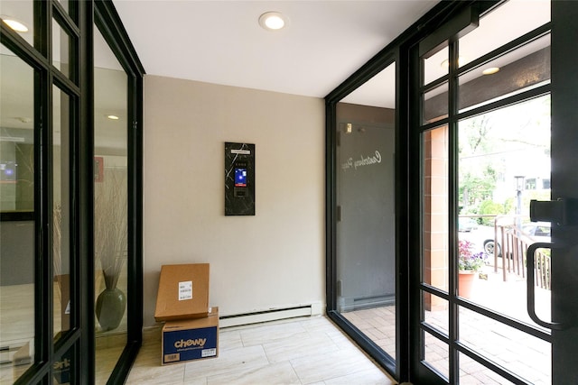 10 Canterbury Rd Apt 2G, Great Neck, NY 11021 - entryway with baseboard heating and expansive windows
