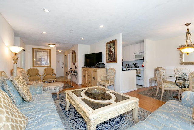 10 Canterbury Rd Apt 2G, Great Neck, NY 11021 - living room featuring light wood-style flooring and recessed lighting