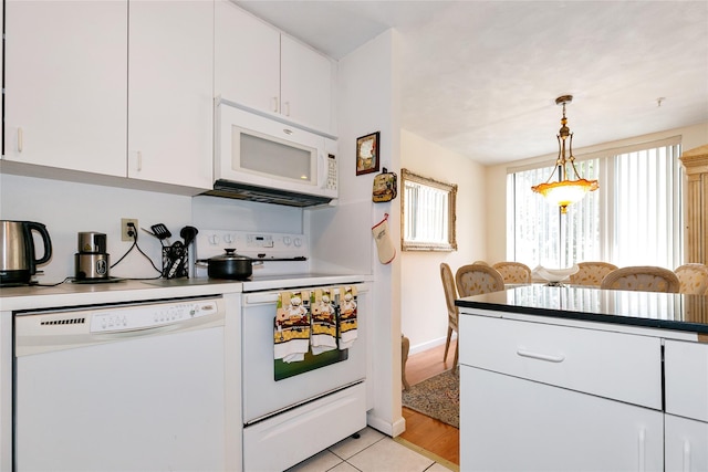 10 Canterbury Rd Apt 2G, Great Neck, NY 11021 - kitchen with white appliances, white cabinets, pendant lighting, and light countertops