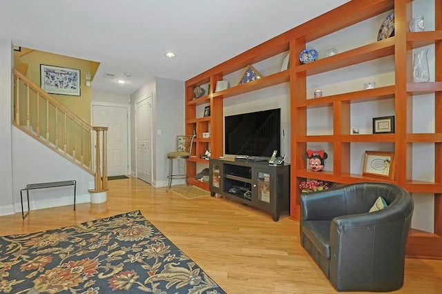 27 Bridge Ln, Haverstraw, NY 10927 - living area featuring stairway, wood finished floors, and recessed lighting