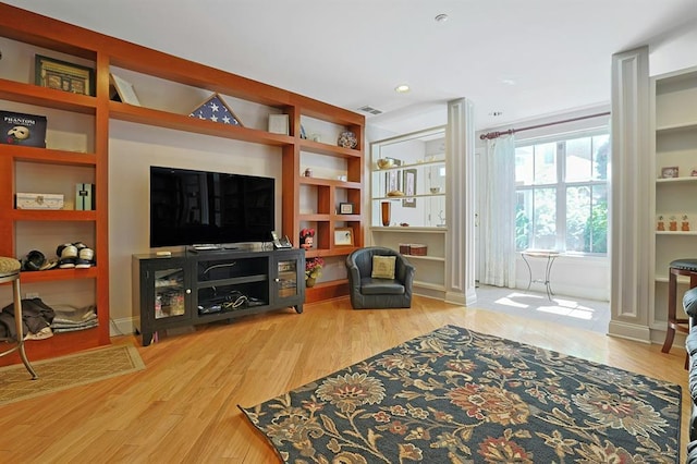27 Bridge Ln, Haverstraw, NY 10927 - living area featuring wood finished floors, built in features, and recessed lighting