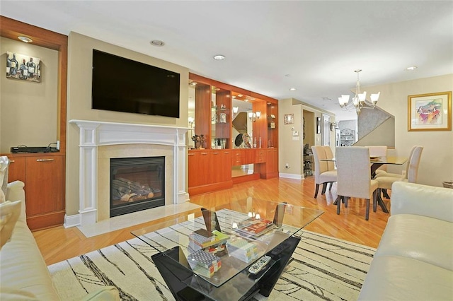 27 Bridge Ln, Haverstraw, NY 10927 - living area with a chandelier, a high end fireplace, wood finished floors, and recessed lighting