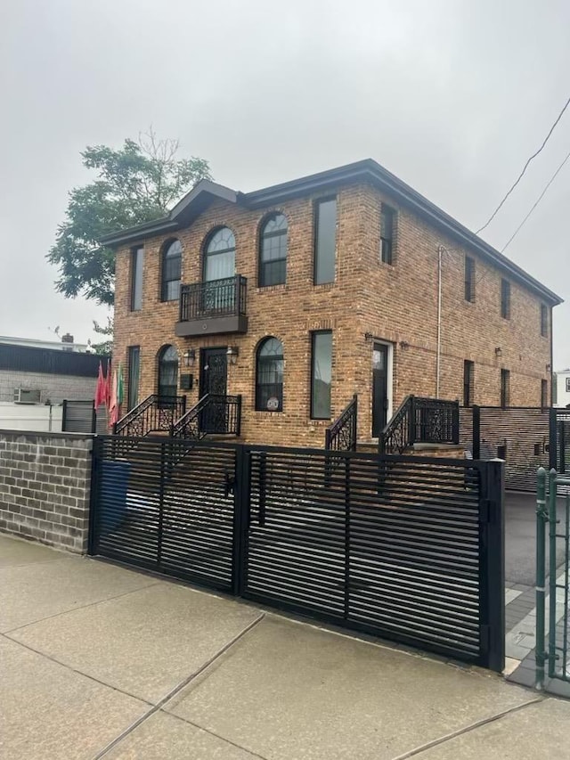15903 131st Ave, Jamaica, NY 11434 - view of front of property featuring a fenced front yard, a gate, and brick siding