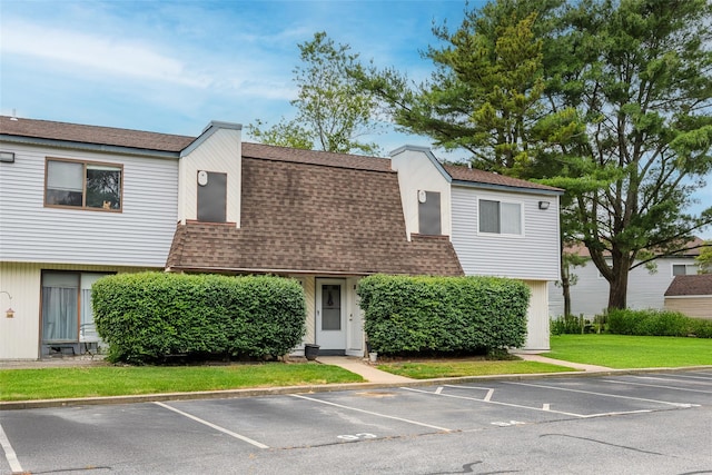 95 Pointe Cir S Unit 95, Coram, NY 11727 - view of front of home with a shingled roof and uncovered parking