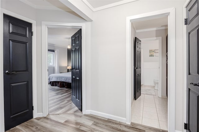 95 Pointe Cir S Unit 95, Coram, NY 11727 - hallway with light wood finished floors and ornamental molding