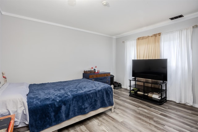 95 Pointe Cir S Unit 95, Coram, NY 11727 - bedroom featuring crown molding and light wood-type flooring