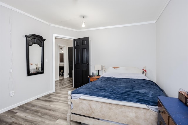 95 Pointe Cir S Unit 95, Coram, NY 11727 - bedroom with wood finished floors and ornamental molding