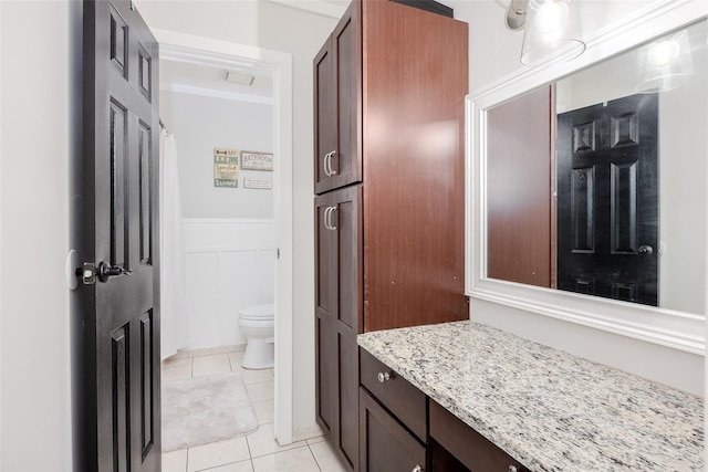 95 Pointe Cir S Unit 95, Coram, NY 11727 - bathroom featuring tile patterned flooring, a wainscoted wall, and vanity