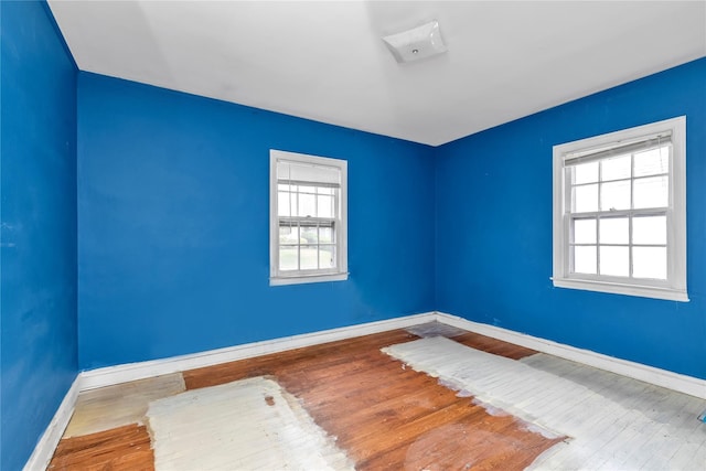 68 Moore St, New Hyde Park, NY 11040 - spare room with wood finished floors