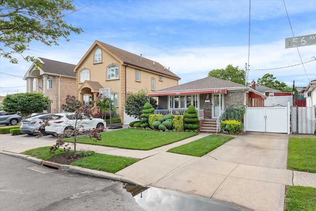 91-23 156th Ave, Howard Beach, NY 11414 - view of front of property with a gate and driveway