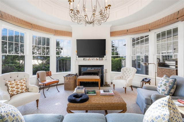 59 Shore Rd, Westhampton, NY 11977 - living area with a chandelier, plenty of natural light, crown molding, and a fireplace