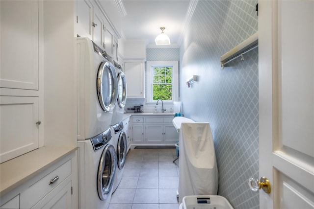59 Shore Rd, Westhampton, NY 11977 - washroom with cabinet space, stacked washer / drying machine, ornamental molding, light tile patterned floors, and wallpapered walls