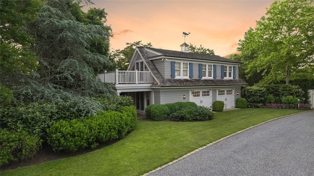 59 Shore Rd, Westhampton, NY 11977 - view of front facade with an attached garage and a yard