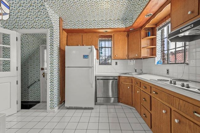 7318 180th St, Fresh Meadows, NY 11366 - kitchen featuring appliances with stainless steel finishes, wallpapered walls, extractor fan, brown cabinets, and open shelves