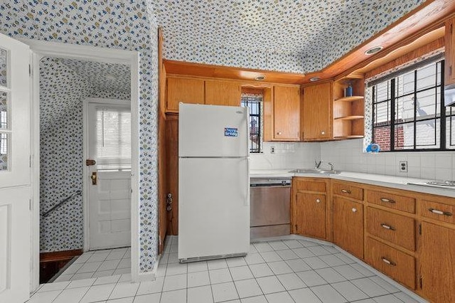 7318 180th St, Fresh Meadows, NY 11366 - kitchen with freestanding refrigerator, wallpapered walls, stainless steel dishwasher, open shelves, and light countertops