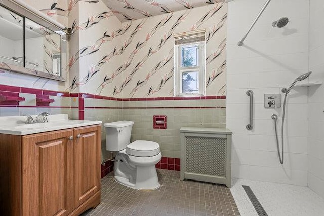 7318 180th St, Fresh Meadows, NY 11366 - full bathroom with radiator heating unit, wallpapered walls, a tile shower, tile walls, and vanity