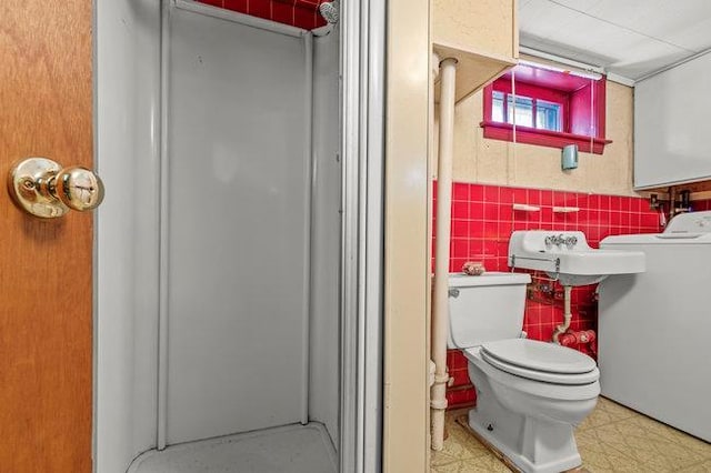 7318 180th St, Fresh Meadows, NY 11366 - bathroom with washer / clothes dryer, a shower stall, and tile patterned floors