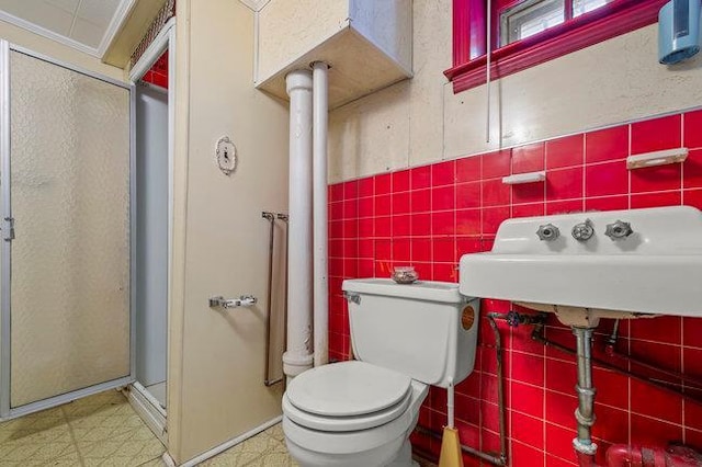 7318 180th St, Fresh Meadows, NY 11366 - bathroom featuring tile walls, a stall shower, and tile patterned floors