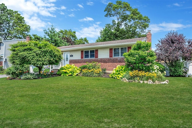41 W 21st St, Deer Park, NY 11729 - ranch-style home with brick siding, a front yard, and a chimney