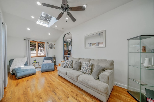 41 W 21st St, Deer Park, NY 11729 - living area featuring a ceiling fan, lofted ceiling, wood finished floors, a skylight, and recessed lighting
