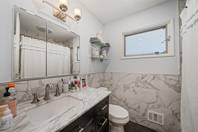 41 W 21st St, Deer Park, NY 11729 - full bath featuring tile walls, vanity, and wainscoting