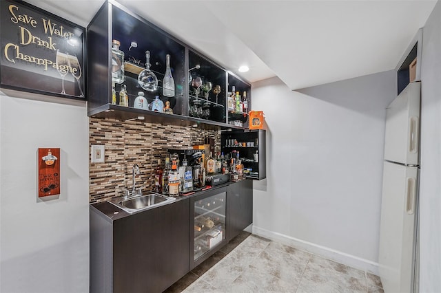 41 W 21st St, Deer Park, NY 11729 - indoor wet bar featuring decorative backsplash, freestanding refrigerator, and tile patterned floors