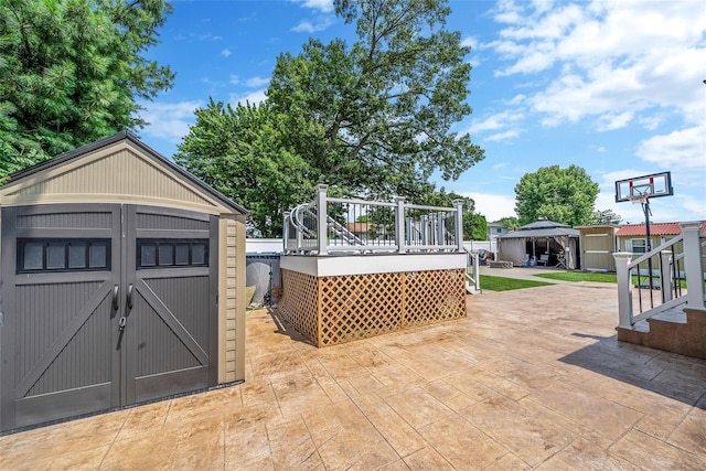 41 W 21st St, Deer Park, NY 11729 - wooden deck featuring a storage shed, a patio area, and a gazebo