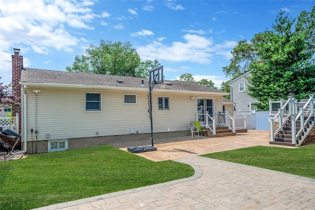 41 W 21st St, Deer Park, NY 11729 - rear view of house featuring a patio area and a chimney