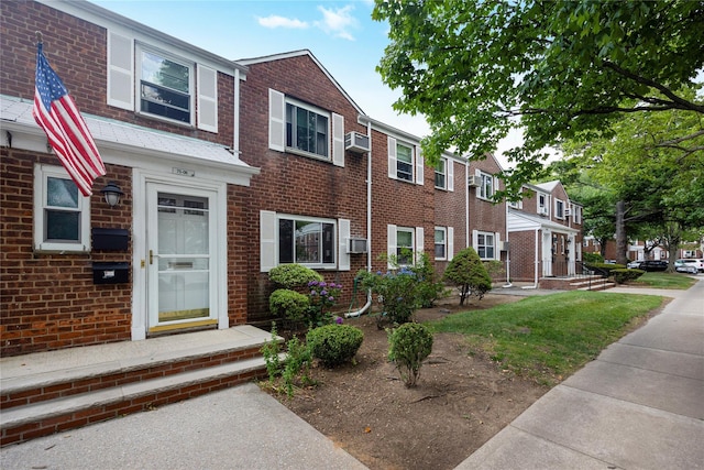 75-06A 255th St Unit A, Glen Oaks, NY 11004 - townhome / multi-family property with brick siding, a residential view, and cooling unit