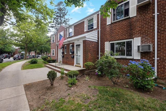 75-06A 255th St Unit A, Glen Oaks, NY 11004 - townhome / multi-family property with brick siding and a wall unit AC