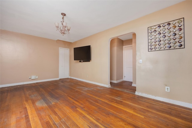 75-06A 255th St Unit A, Glen Oaks, NY 11004 - spare room with arched walkways, wood-type flooring, and a chandelier