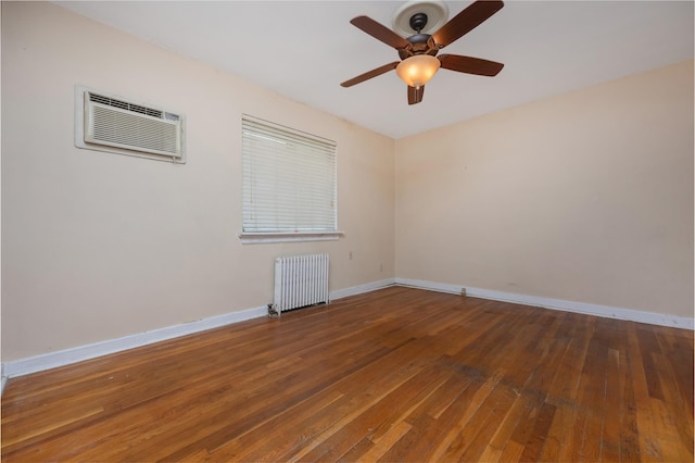 75-06A 255th St Unit A, Glen Oaks, NY 11004 - empty room featuring radiator, a wall mounted AC, hardwood / wood-style flooring, and ceiling fan