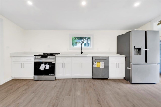 8 Pioneer Trl, Monroe, NY 10950 - kitchen featuring stainless steel appliances, light wood-style floors, white cabinets, light countertops, and recessed lighting