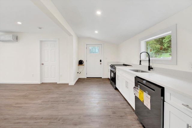 8 Pioneer Trl, Monroe, NY 10950 - kitchen with dishwasher, stainless steel range with electric cooktop, plenty of natural light, light wood finished floors, and lofted ceiling