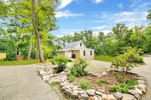 8 Pioneer Trl, Monroe, NY 10950 - view of front of home with a shed and view of wooded area