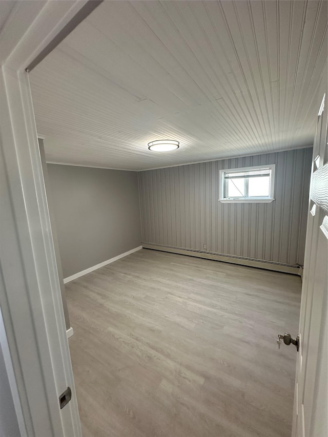 833 Bermuda Rd, West Babylon, NY 11704 - basement with light wood-style floors, wooden ceiling, and a baseboard heating unit