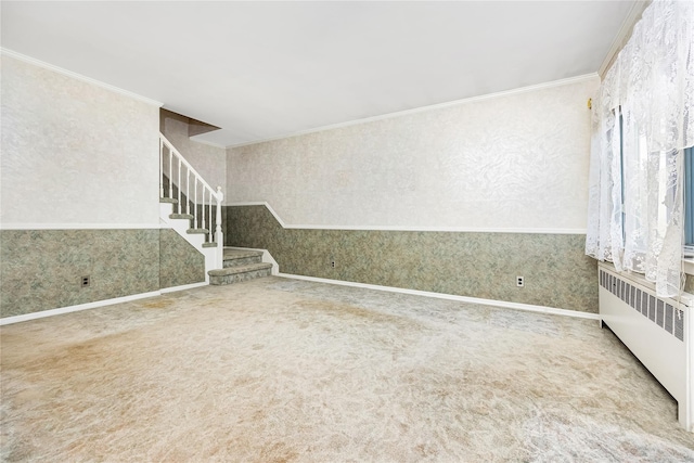 245 E Seaman Ave, Freeport, NY 11520 - unfurnished living room featuring wallpapered walls, radiator heating unit, stairs, carpet flooring, and crown molding