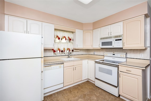 245 E Seaman Ave, Freeport, NY 11520 - kitchen with white appliances, light countertops, and white cabinetry