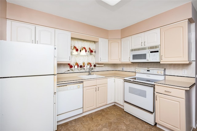 245 E Seaman Ave, Freeport, NY 11520 - kitchen with white appliances, light countertops, and white cabinetry